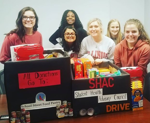 SHAC student working in a food donation table