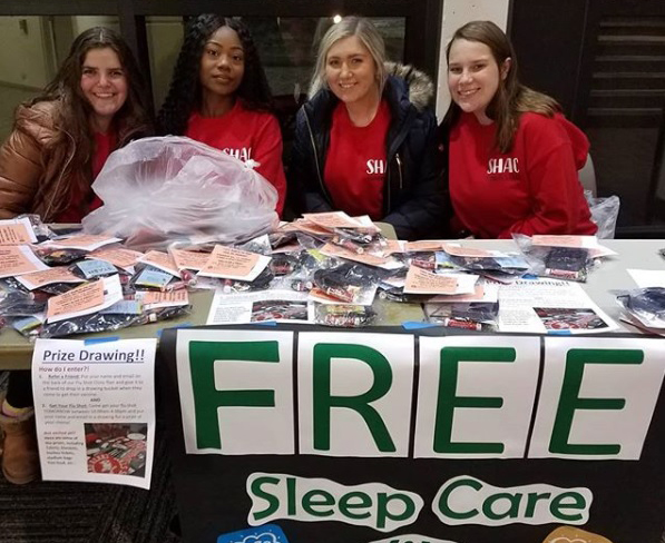 SHAC Students giving sleep kits